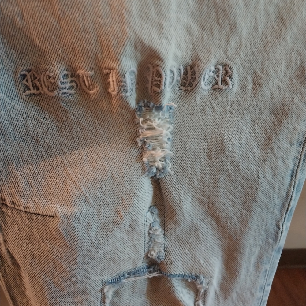 RtA Bryant Rest in power distressed jean